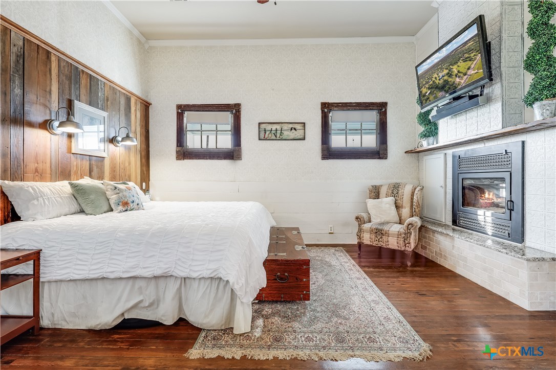 13471 Cedar Valley Road Salado, TX 76571 - Photo 16 of 41 a bedroom with a bed and a couch