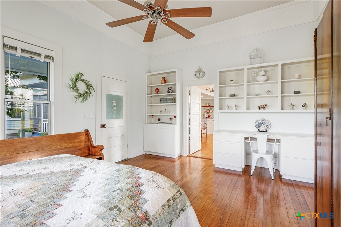 13471 Cedar Valley Road Salado, TX 76571 - Photo 18 of 41 a bedroom with a bed and wooden floor