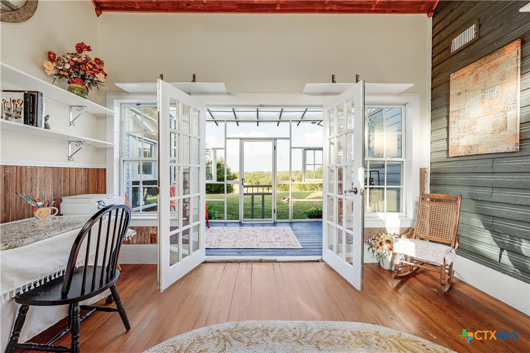 13471 Cedar Valley Road Salado, TX 76571 - Photo 21 of 41 a living room with furniture and wooden floor