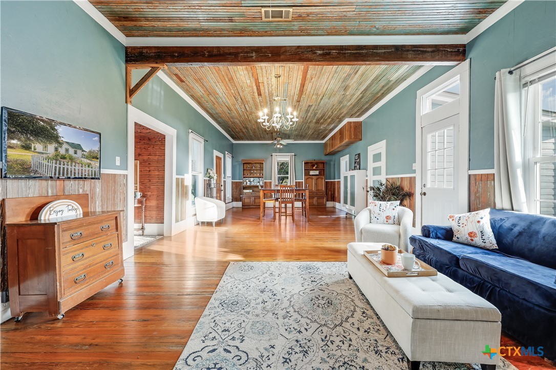 13471 Cedar Valley Road Salado, TX 76571 - Photo 23 of 41 a living room with furniture and a wooden floor