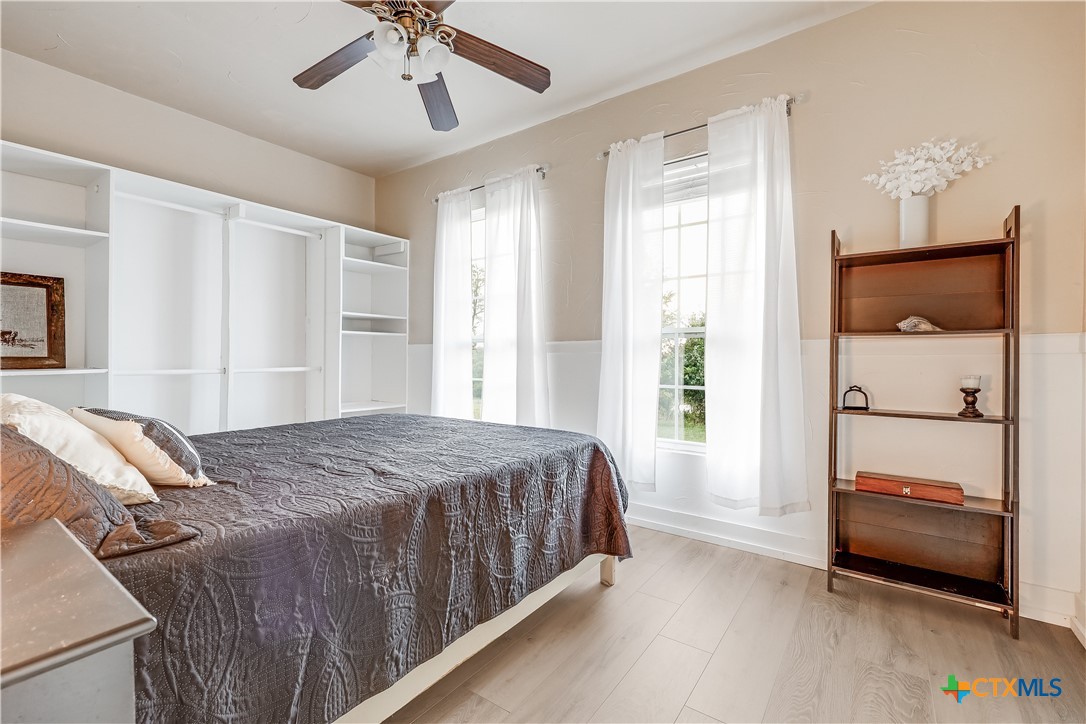13471 Cedar Valley Road Salado, TX 76571 - Photo 36 of 41 a bedroom with a bed and a window
