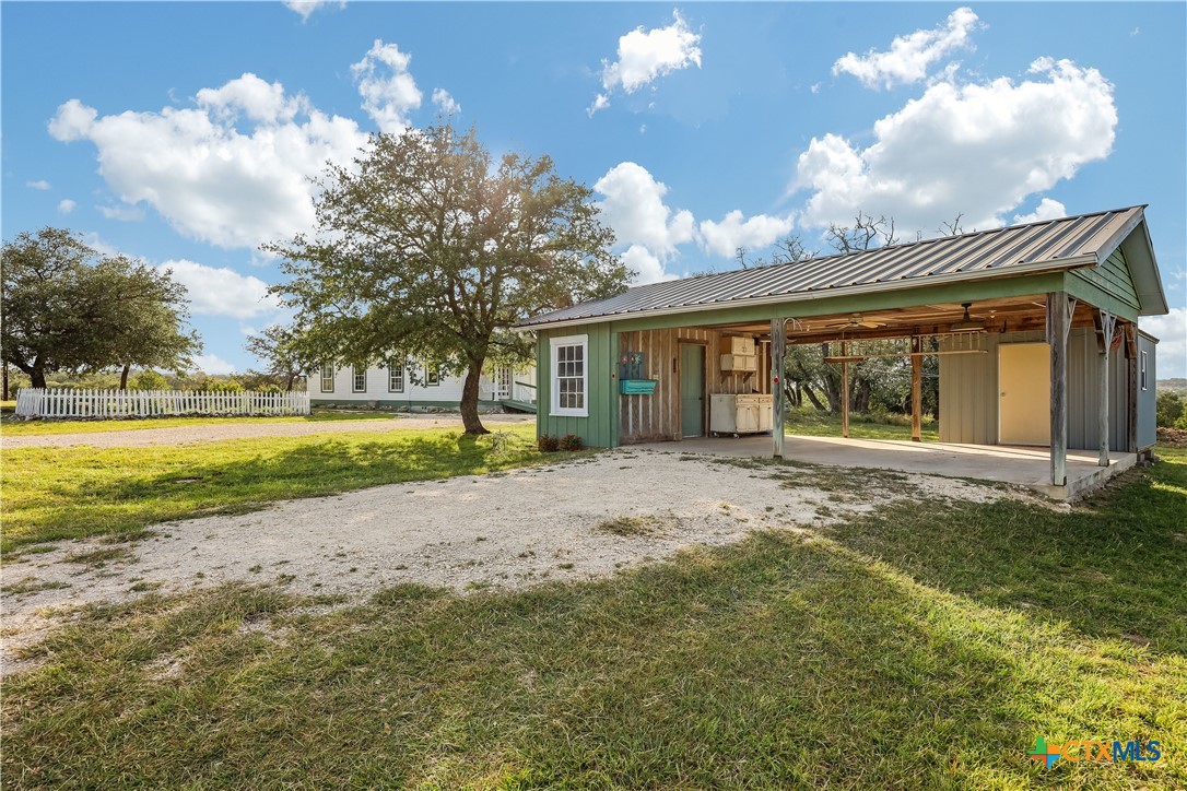 13471 Cedar Valley Road Salado, TX 76571 - Photo 37 of 41 a view of a house with a yard and a large tree