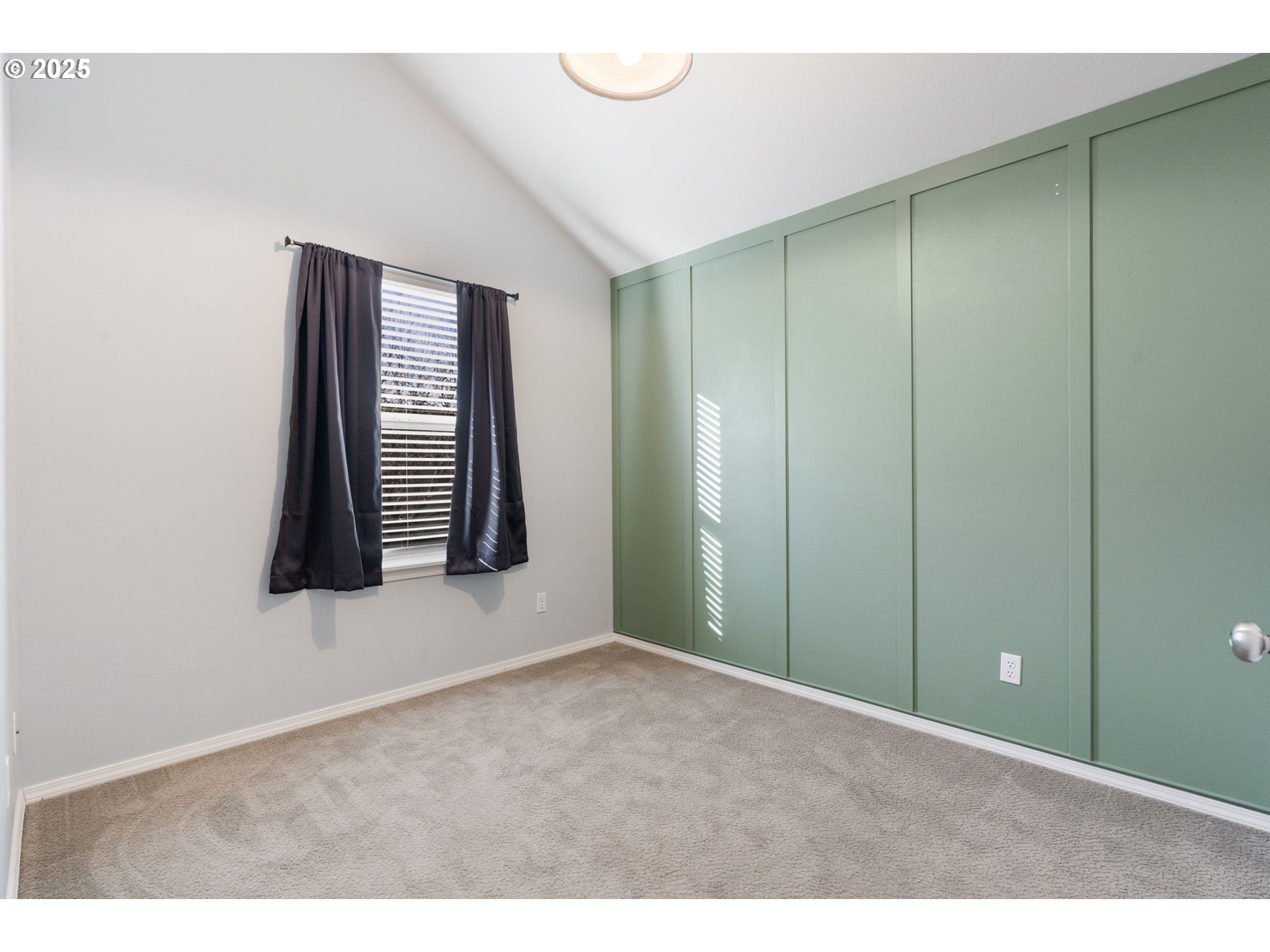 887 Southwest 198th Place Beaverton, OR 97003 - Photo 17 of 33 a view of an empty room with closet and mirror