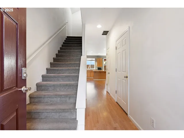 a view of entryway with wooden floor