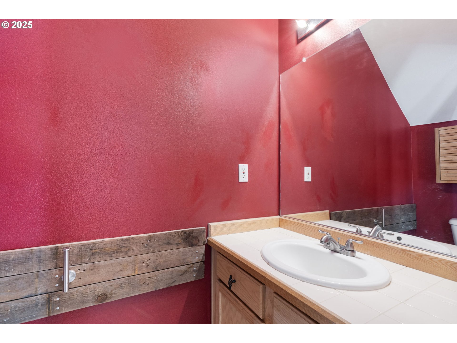 887 Southwest 198th Place Beaverton, OR 97003 - Photo 4 of 33 a bathroom with a sink and a mirror