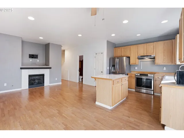 a view of kitchen with cabinets and wooden floor