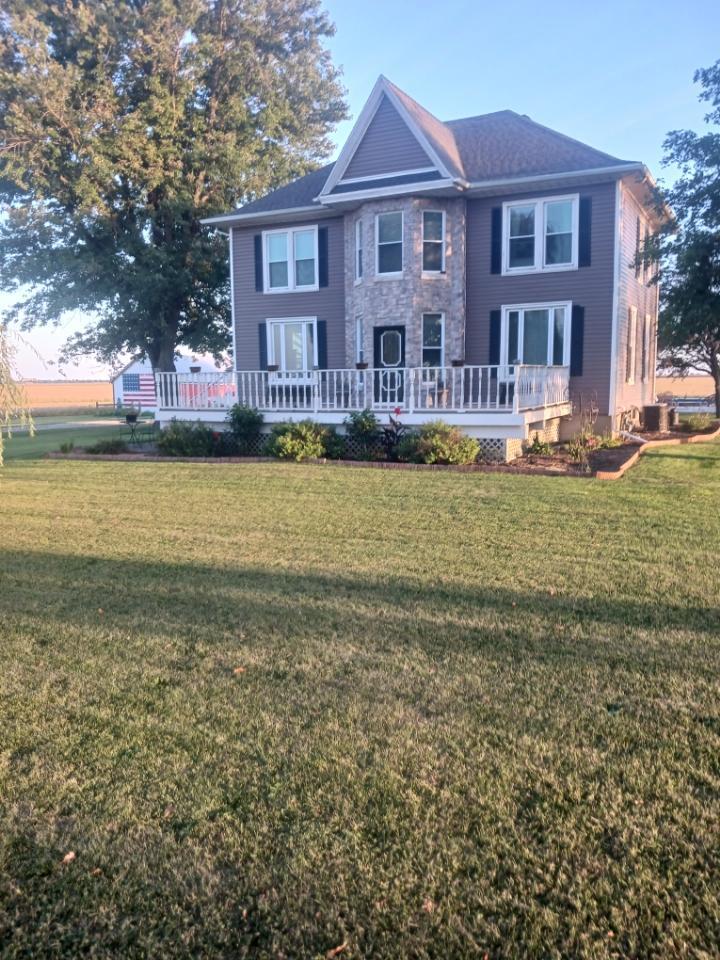 1532 North 2250th Road Ottawa, IL 61350 - Photo 1 of 38 a front view of a house with swimming pool having outdoor seating