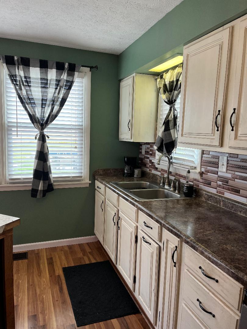 1532 North 2250th Road Ottawa, IL 61350 - Photo 13 of 38 a kitchen with granite countertop a sink and a window
