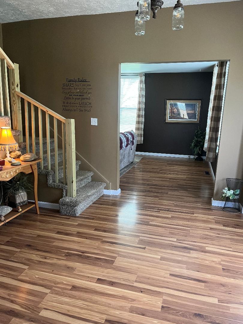 1532 North 2250th Road Ottawa, IL 61350 - Photo 17 of 38 a view of empty room with wooden floor and fan