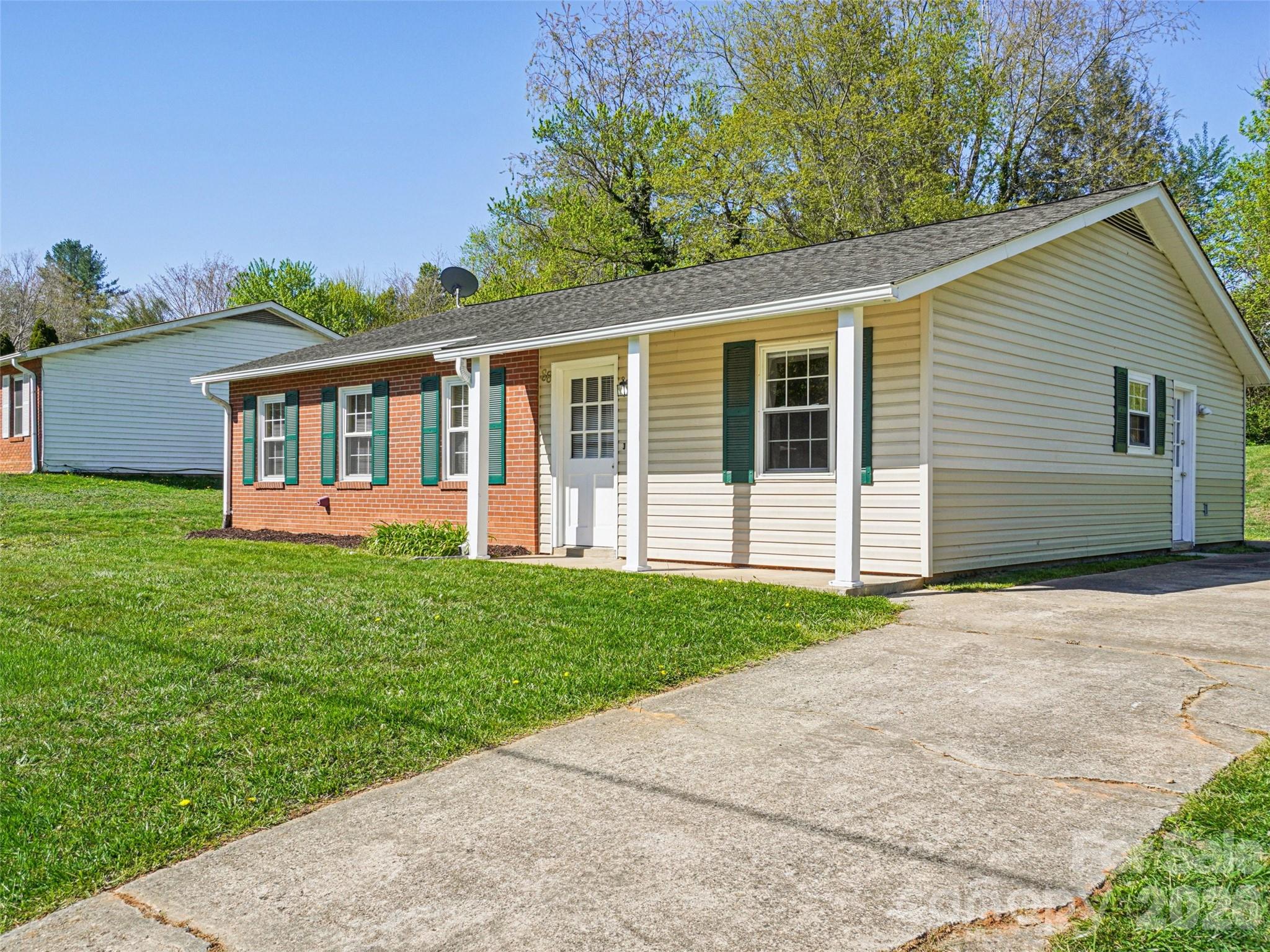 88 Lees Creek Road Asheville, NC 28806 - Photo 1 of 29 a view of a house with backyard and garden