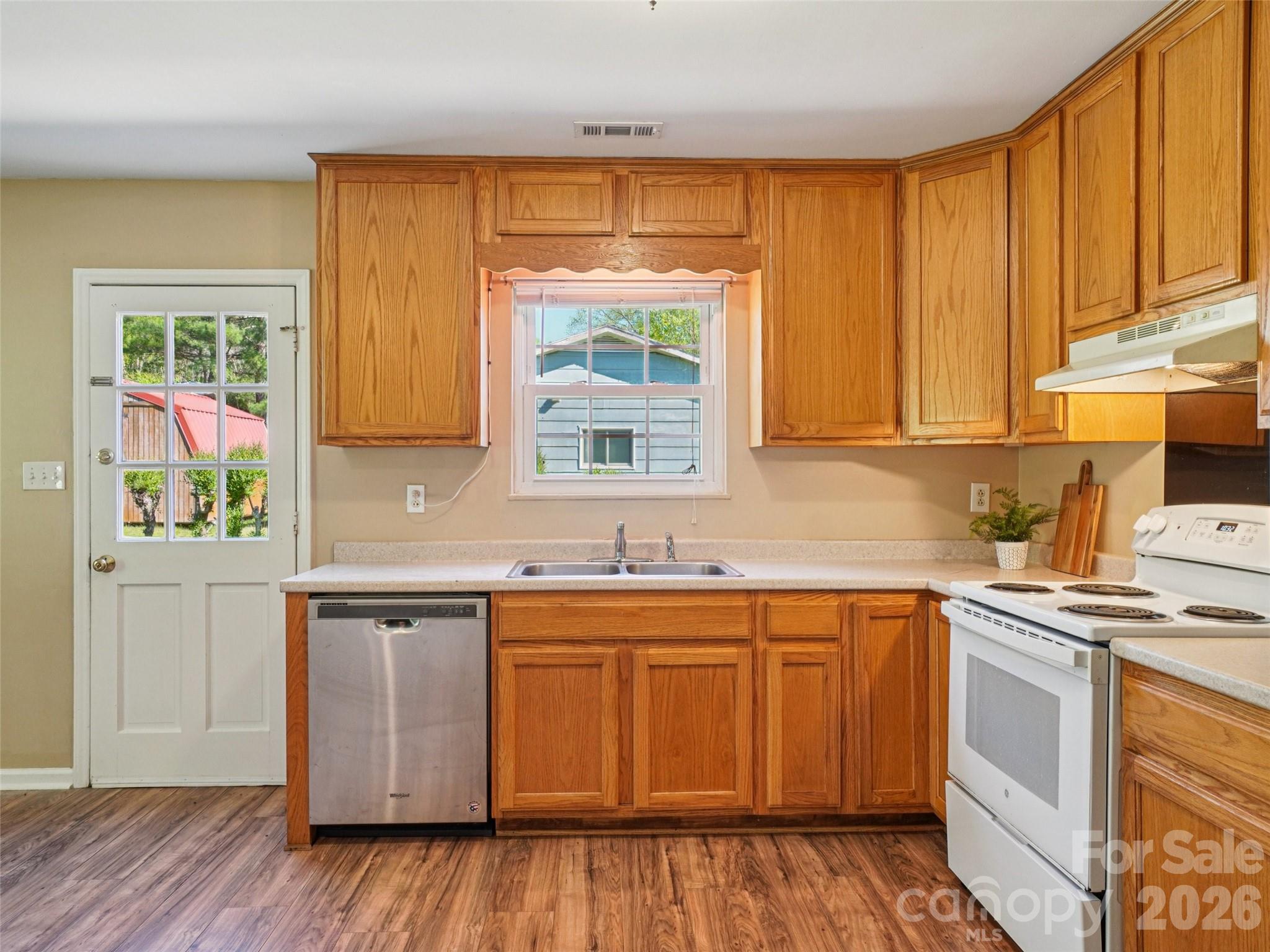 88 Lees Creek Road Asheville, NC 28806 - Photo 11 of 29 a kitchen with a sink stove and cabinets