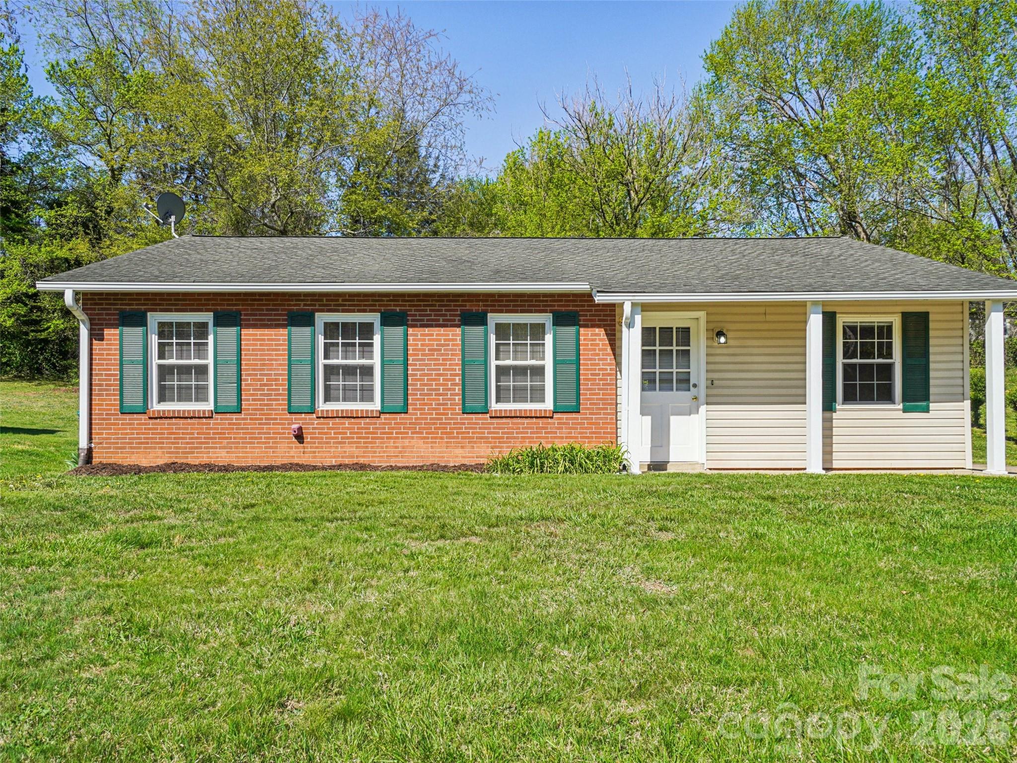88 Lees Creek Road Asheville, NC 28806 - Photo 2 of 29 a house view with a garden space