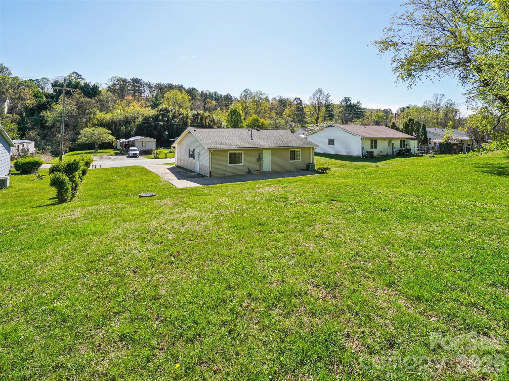 88 Lees Creek Road Asheville, NC 28806 - Photo 23 of 29 a view of a house with a yard and sitting area