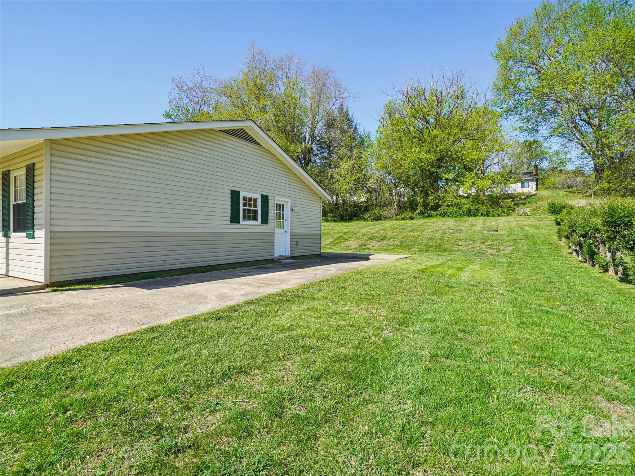 88 Lees Creek Road Asheville, NC 28806 - Photo 28 of 29 a house view with a garden space