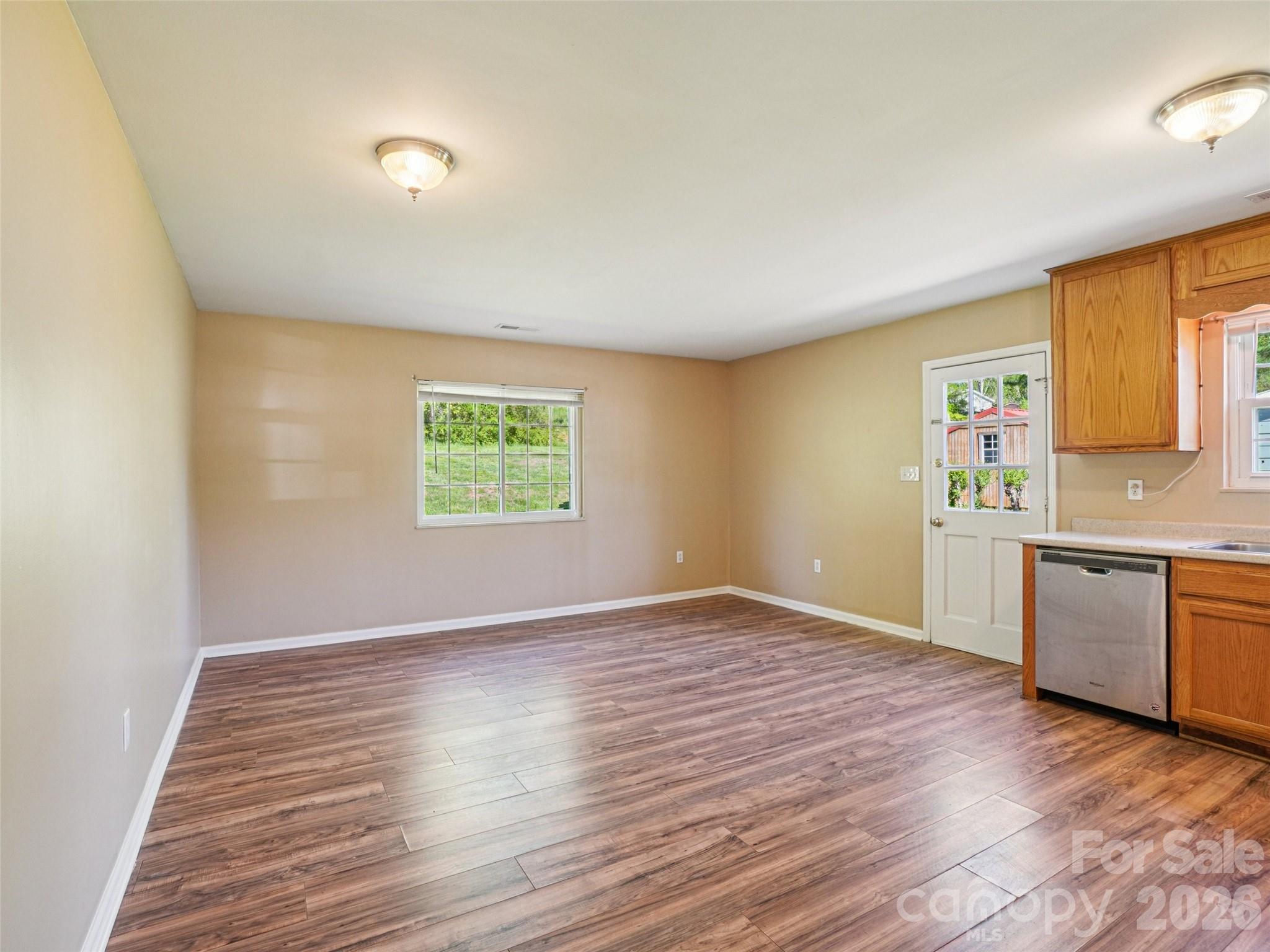 88 Lees Creek Road Asheville, NC 28806 - Photo 7 of 29 a view of a kitchen with a sink and a stove top oven
