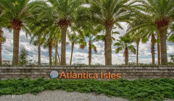 a sign that is sitting in front of a house