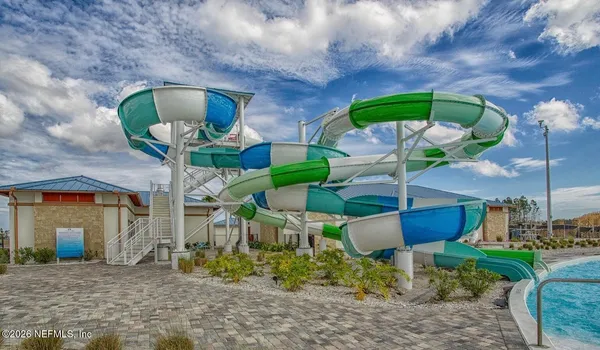 a view of swimming pool and a yard
