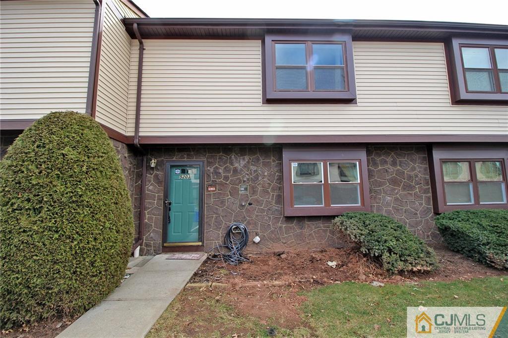 5203 Hana Road Edison, NJ 08817 - Photo 1 of 25 a front view of a house with garden