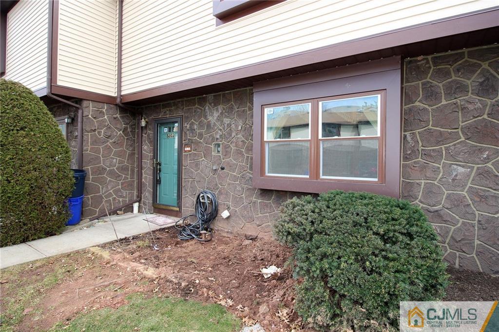 5203 Hana Road Edison, NJ 08817 - Photo 2 of 25 a front view of a house with a yard