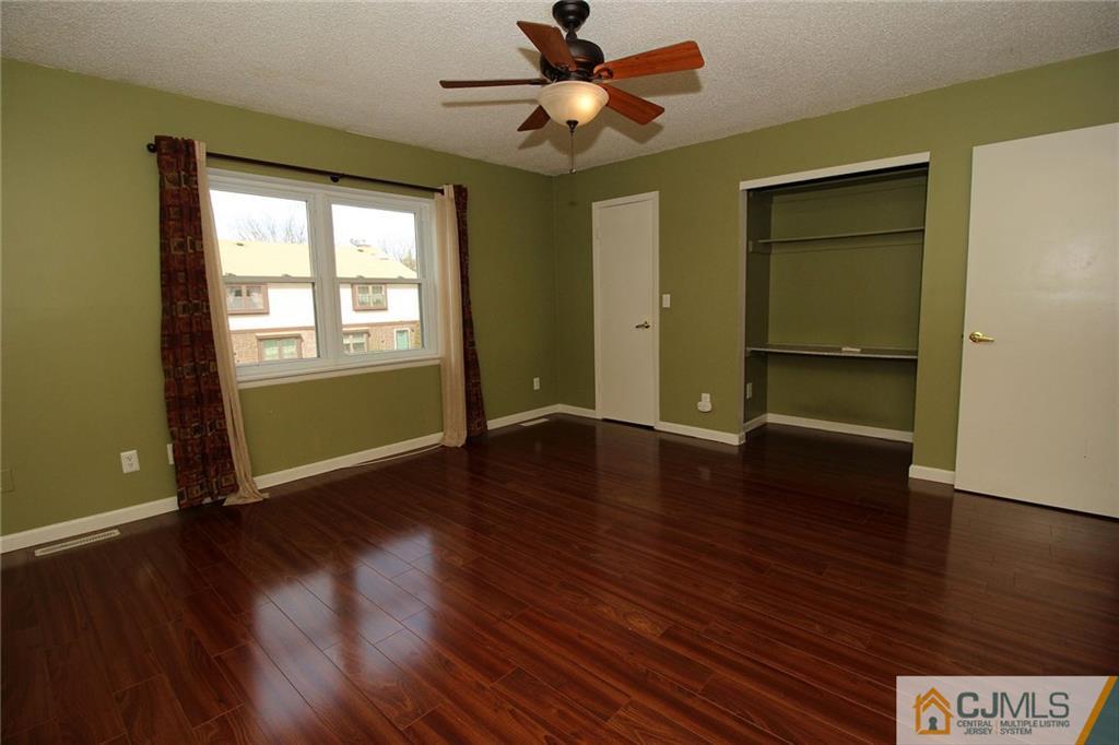 5203 Hana Road Edison, NJ 08817 - Photo 17 of 25 a view of room with window wooden floor and window