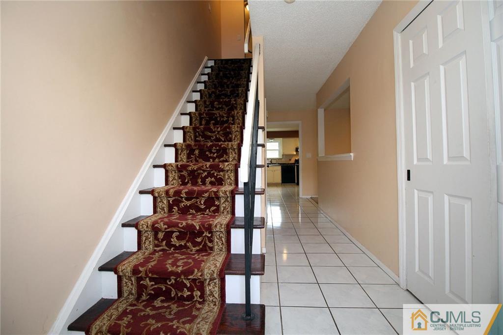 5203 Hana Road Edison, NJ 08817 - Photo 3 of 25 a view of entryway with stairs