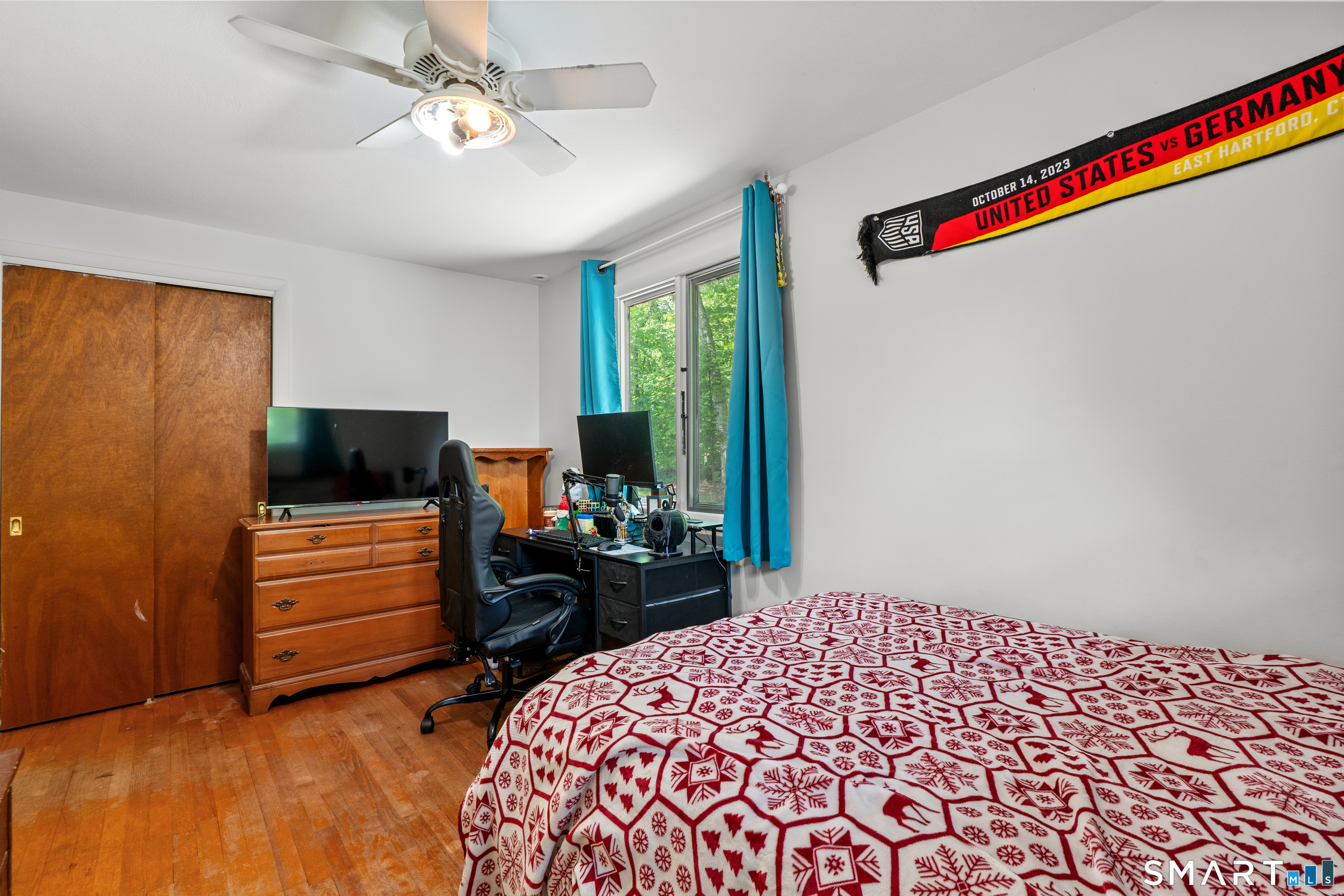 107 Round Hill Road Wethersfield, CT 06109 - Photo 31 of 40 a bedroom with a bed and a television