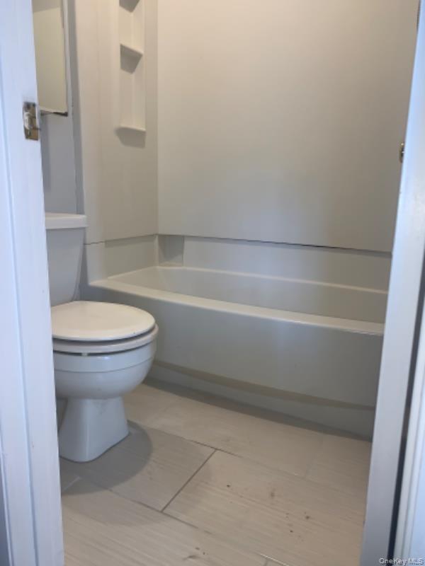 20 Fox Ridge Woodridge, NY 12789 - Photo 13 of 24 Bathroom with shower / bath combination and light tile patterned floors
