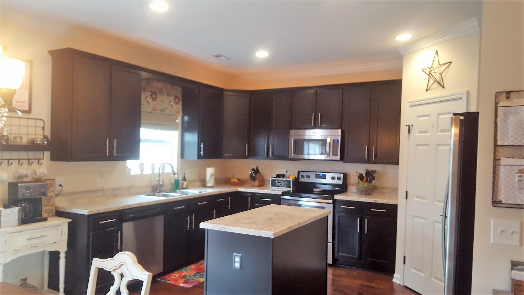 6041 Cane Springs Road Antioch, TN 37013 - Photo 2 of 29 Another view of the stunning kitchen! Notice the floors, and Yes...a window overlooking the back yard.