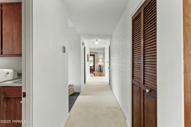 a utility room with a sink washer and dryer