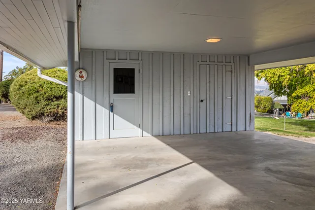 a view of a patio with table and chairs and wooden floor