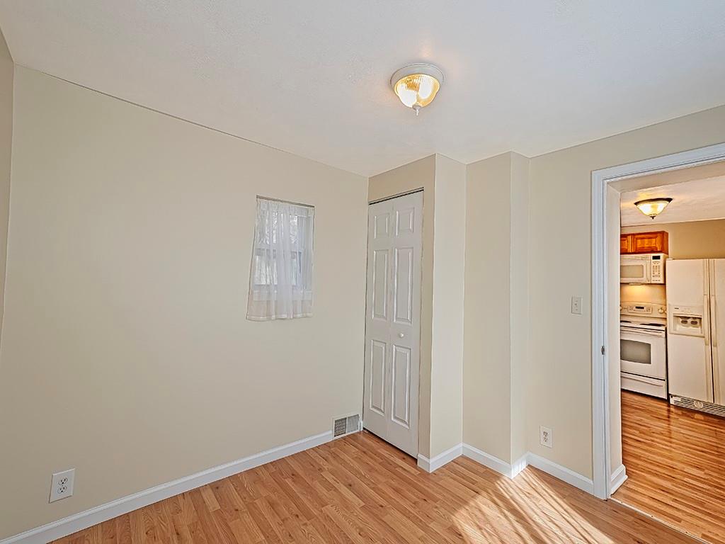 232 New Castle Street Slippery Rock, PA 16057 - Photo 12 of 23 an empty room with wooden floor and closet