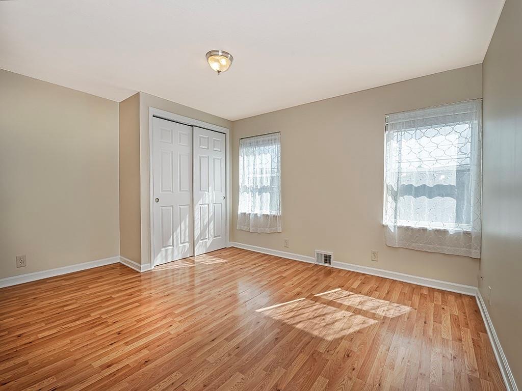 232 New Castle Street Slippery Rock, PA 16057 - Photo 14 of 23 an empty room with wooden floor and windows