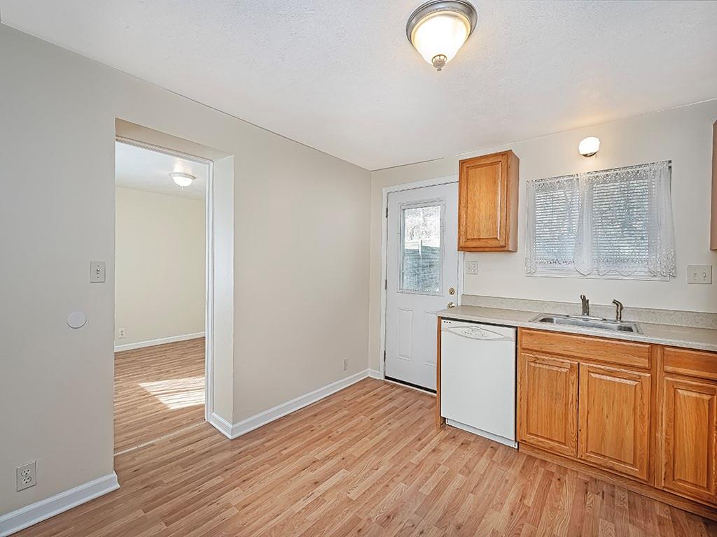 232 New Castle Street Slippery Rock, PA 16057 - Photo 5 of 23 a kitchen with a sink cabinets and wooden floor
