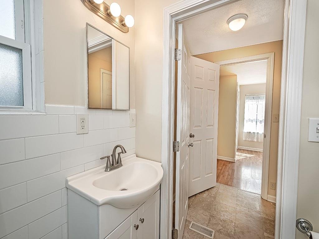 232 New Castle Street Slippery Rock, PA 16057 - Photo 9 of 23 a bathroom with a sink a toilet and shower