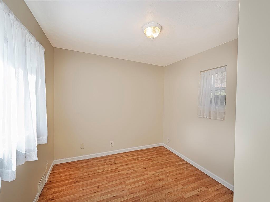 232 New Castle Street Slippery Rock, PA 16057 - Photo 10 of 23 a view of empty room with wooden floor and fan