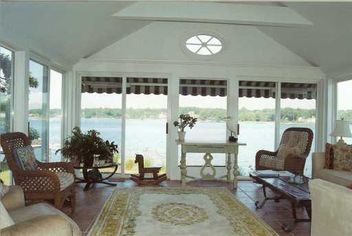 Undisclosed Address Darien, CT 06820 - Photo 3 of 7 a living room with furniture and a large window