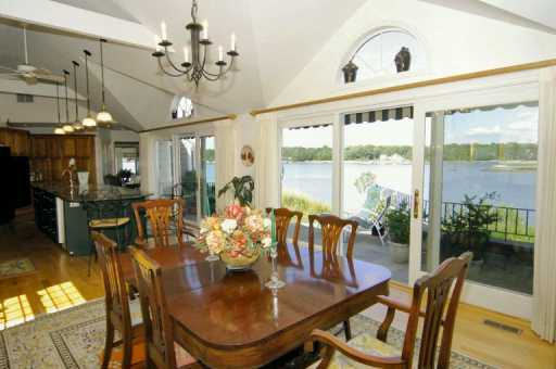 Undisclosed Address Darien, CT 06820 - Photo 5 of 7 a view of a dining room with furniture window and outside view