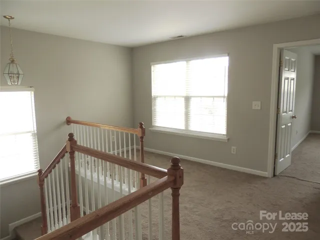 a view of a hallway with windows