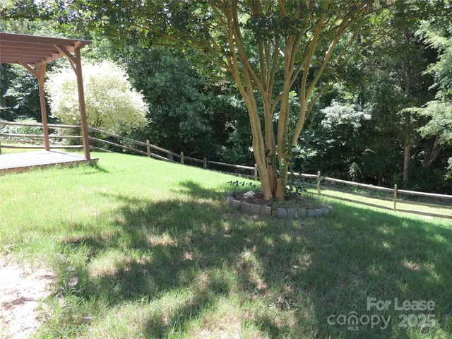 a view of swimming pool with a yard