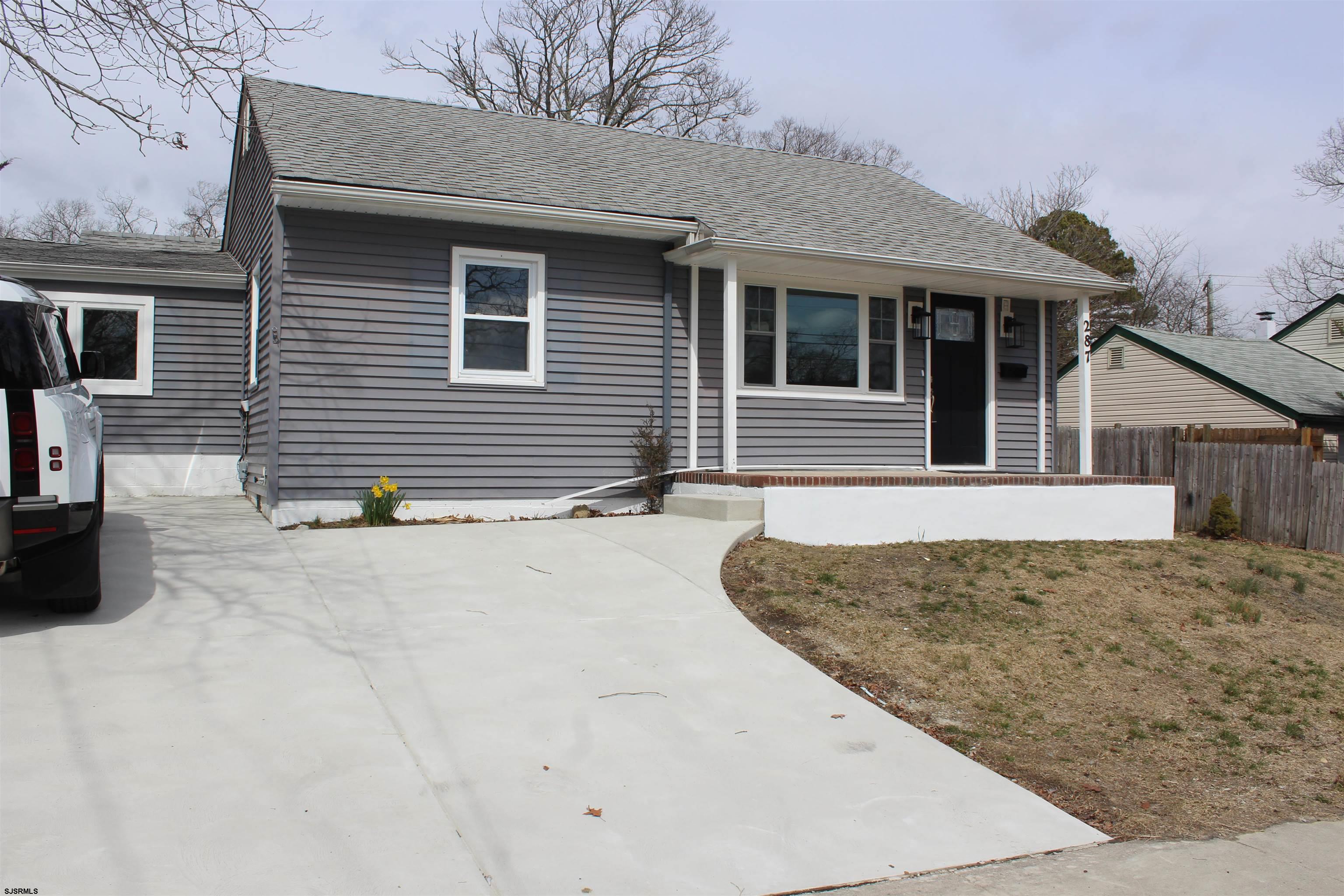 287 New Road Absecon, NJ 08201 - Photo 1 of 29 a view of a house with snow on the road