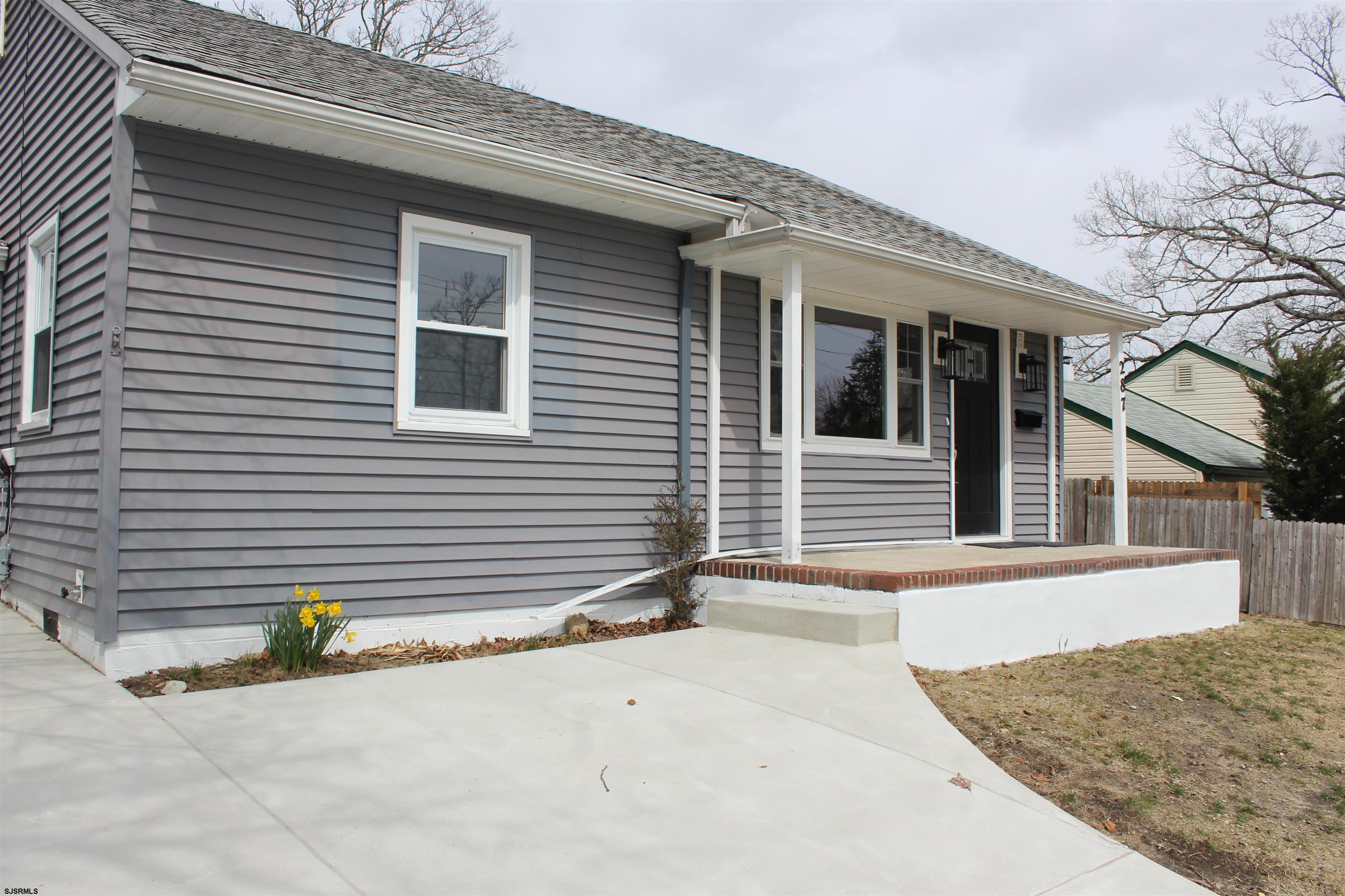 287 New Road Absecon, NJ 08201 - Photo 2 of 29 a view of a house with snow