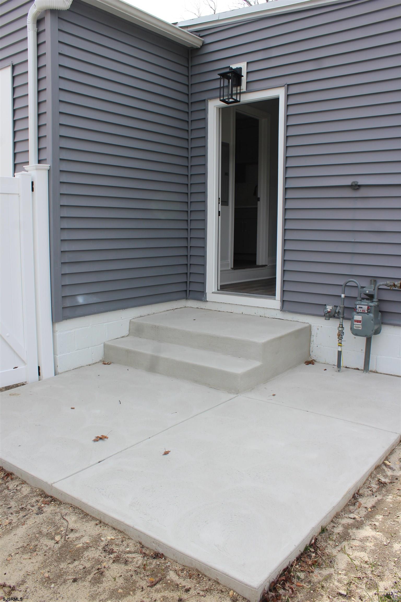 287 New Road Absecon, NJ 08201 - Photo 25 of 29 a view of a house with a patio