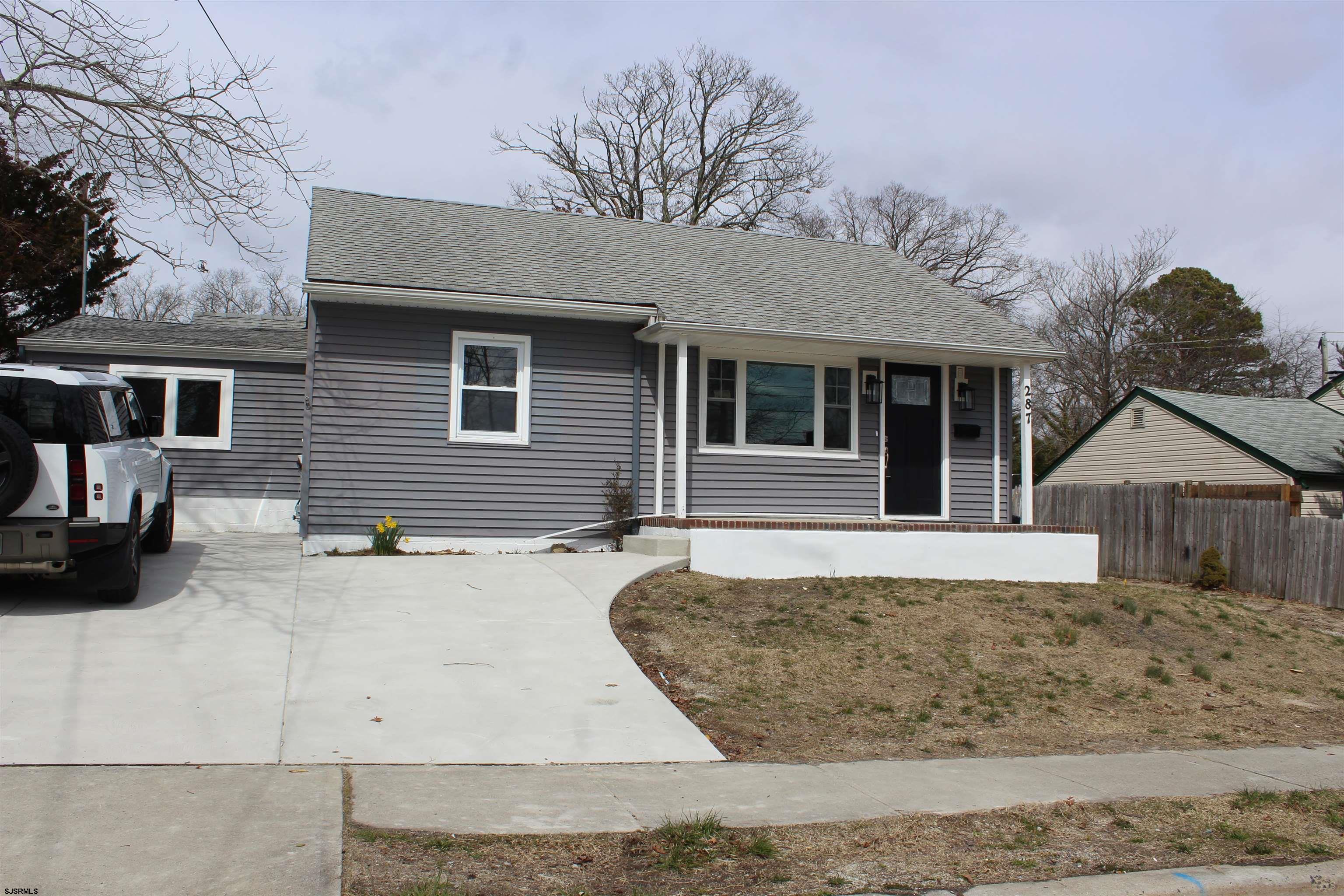 287 New Road Absecon, NJ 08201 - Photo 3 of 29 a view of a house with a yard and potted plants