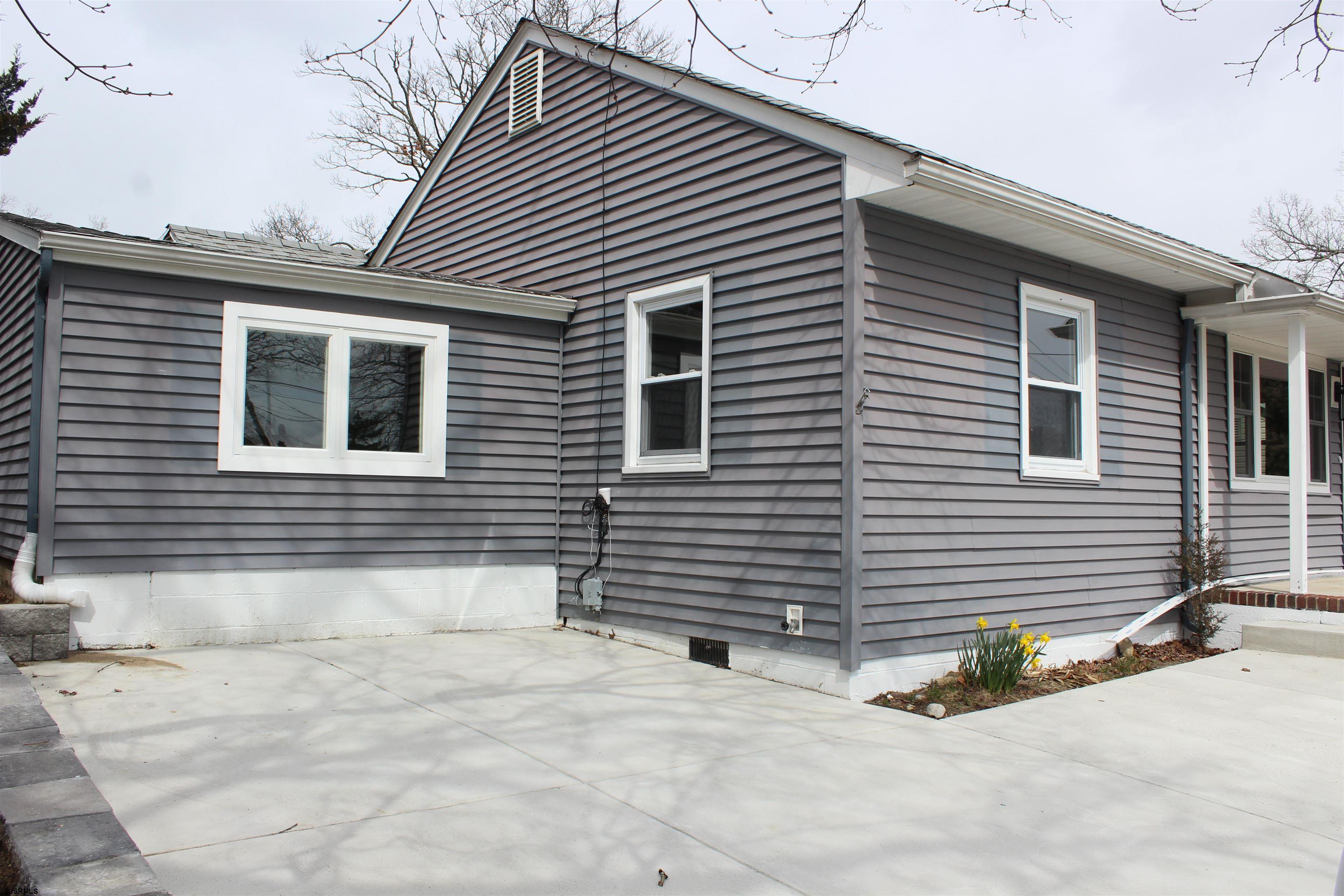 287 New Road Absecon, NJ 08201 - Photo 6 of 29 a view of a house with a patio