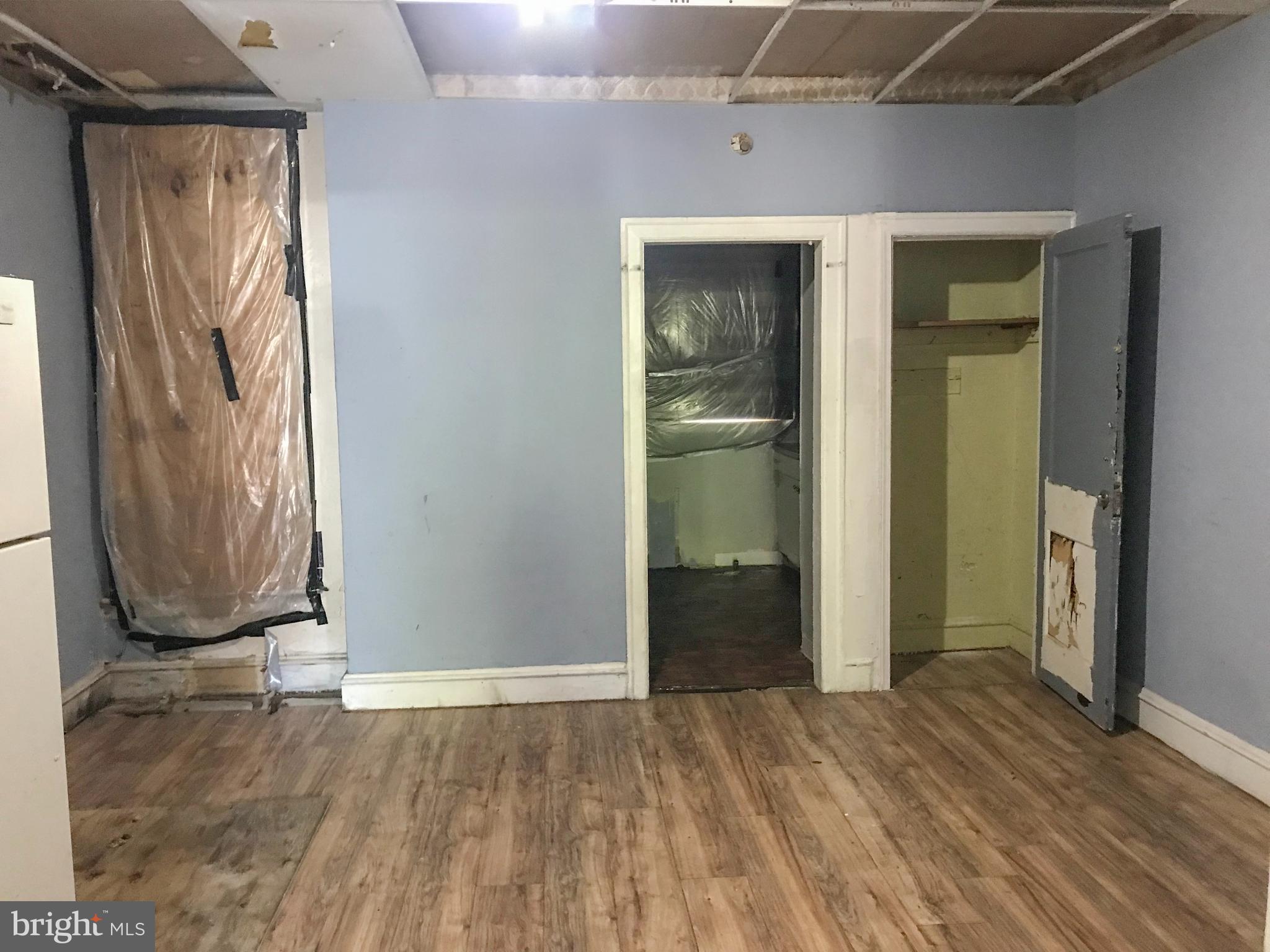 4613 Vista Street Philadelphia, PA 19136 - Photo 14 of 21 an empty room with wooden floor and a window