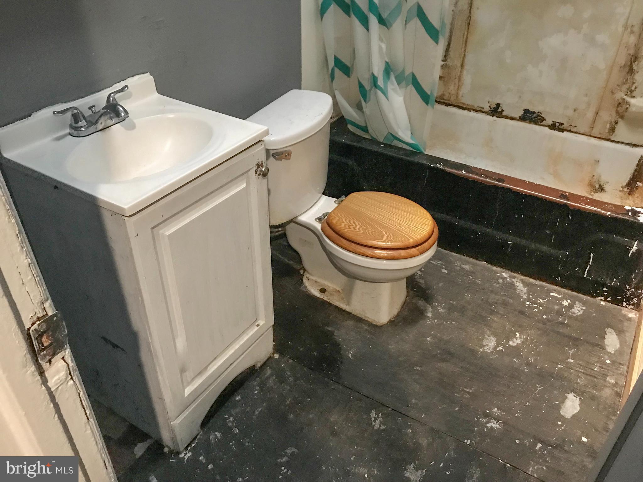 4613 Vista Street Philadelphia, PA 19136 - Photo 18 of 21 a white toilet sitting next to a bathroom sink