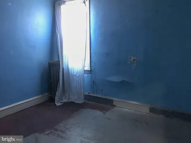 an empty room that has a window