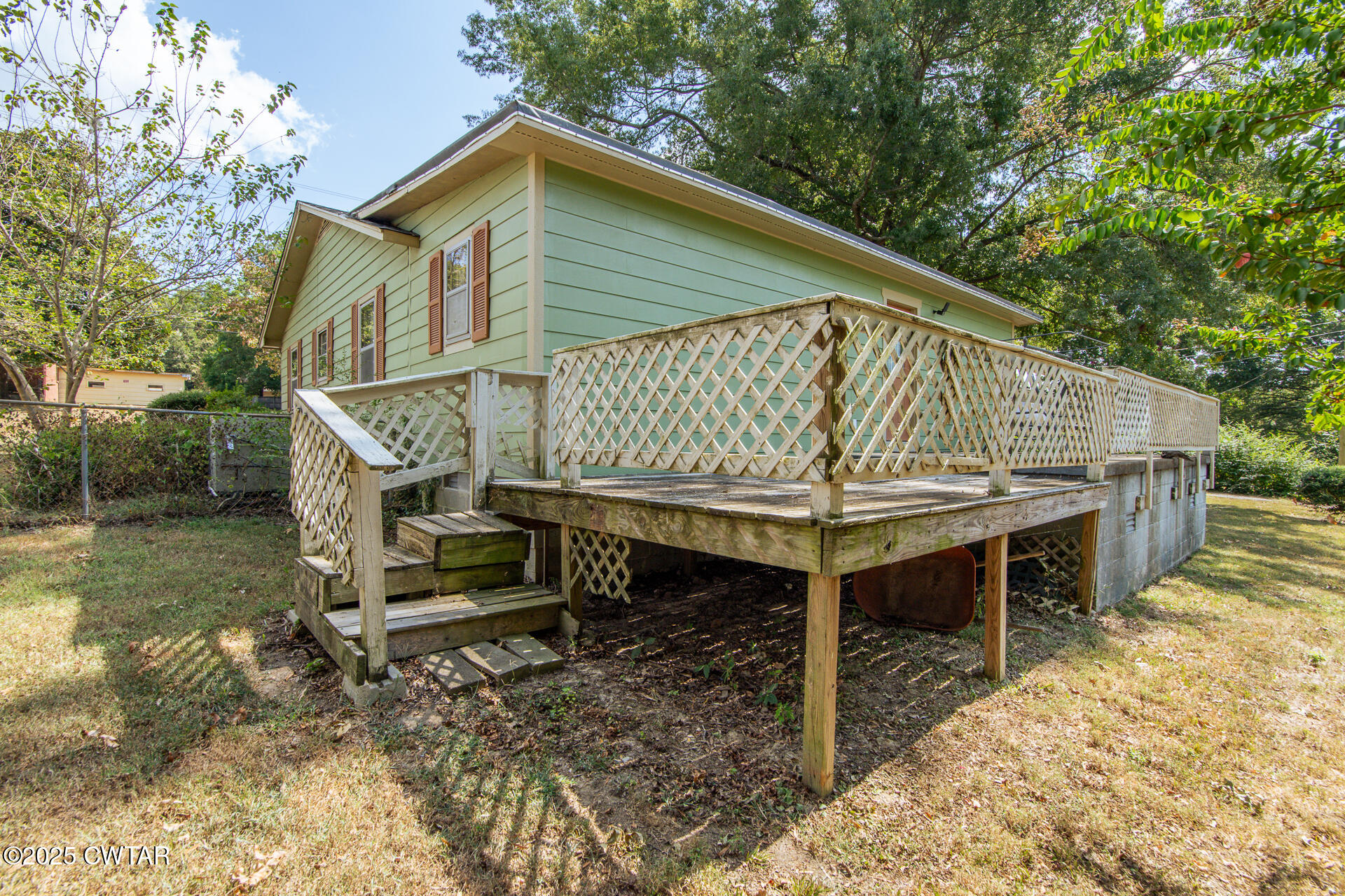 142 South Poplar Street Dyer, TN 38330 - Photo 24 of 28 a roof deck with table and chairs