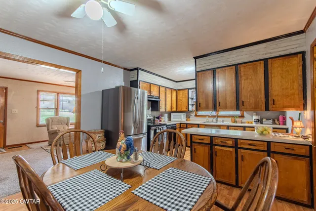 a view of a dining room with furniture window and outside view