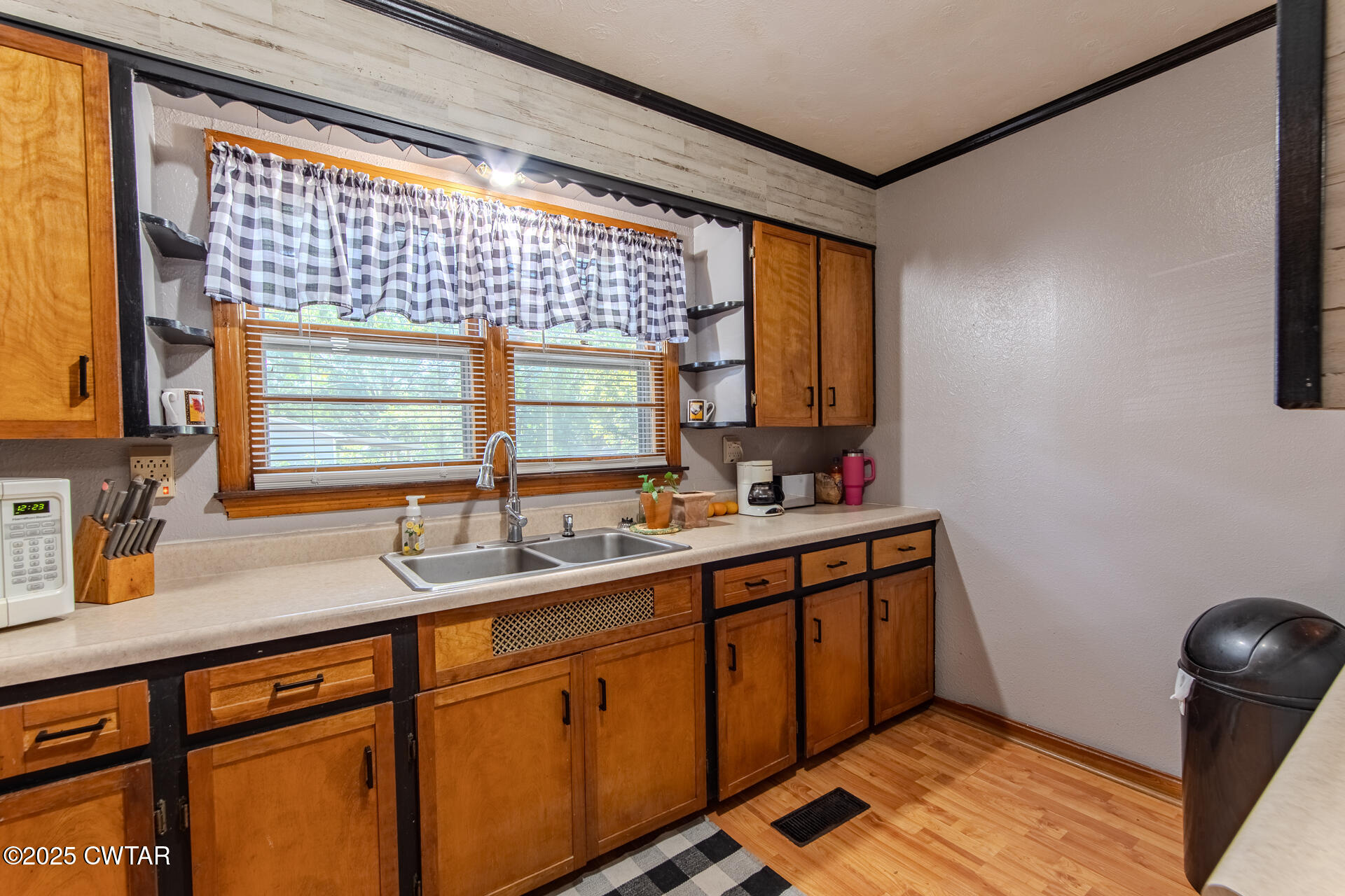 142 South Poplar Street Dyer, TN 38330 - Photo 10 of 28 a kitchen with a sink and a window